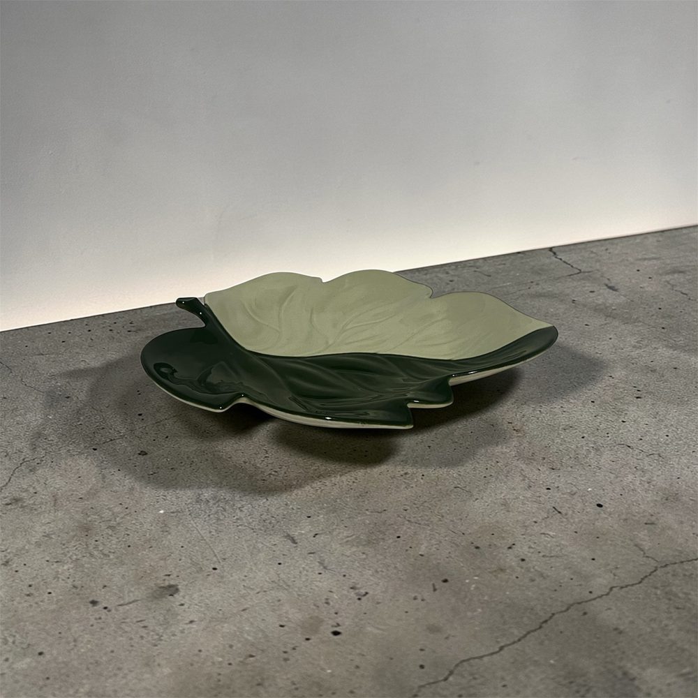 Carlton Ware leaf dish on a concrete floor