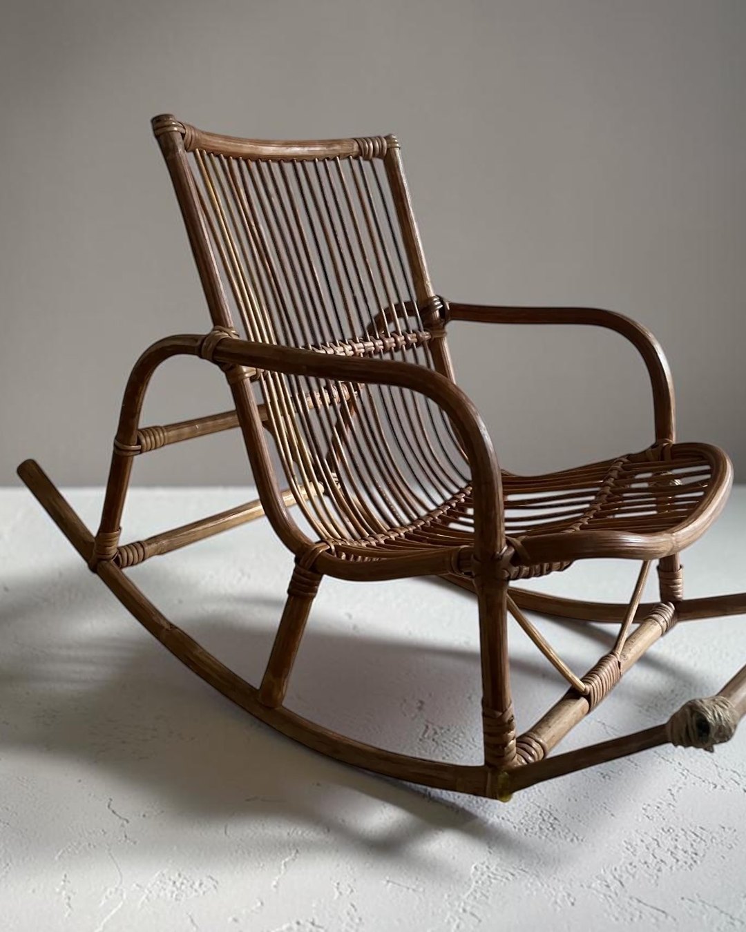 Vintage child's cane and rattan rocking chair
